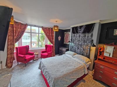 Mary Shelley themed room with side view of sea + walk-in shower